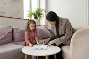 child-doing-therapy-session-with-psychologist