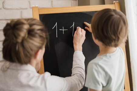tutor-teaching-child-at-home-mathematics